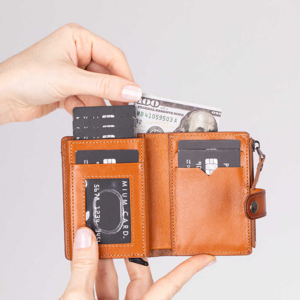Compact leather pop-up card holder wallet with a secure zipper compartment for coins and small essentials. This sleek,
handmade wallet features RFID protection, quick-access card mechanism, and multiple card slots. A stylish and
functional everyday wallet for men and women.