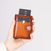 Compact leather pop-up card holder wallet with a secure zipper compartment for coins and small essentials. This sleek,
handmade wallet features RFID protection, quick-access card mechanism, and multiple card slots. A stylish and
functional everyday wallet for men and women.