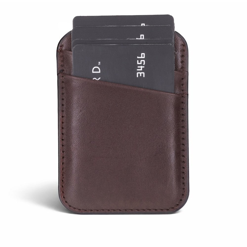 Slim leather magnetic card holder designed for MagSafe-enabled phones, featuring angled slots for easy card access.
Handmade from genuine leather with a strong magnetic attachment, it securely stores credit, debit, and ID cards. A
stylish, pocket-friendly card organizer for everyday convenience.